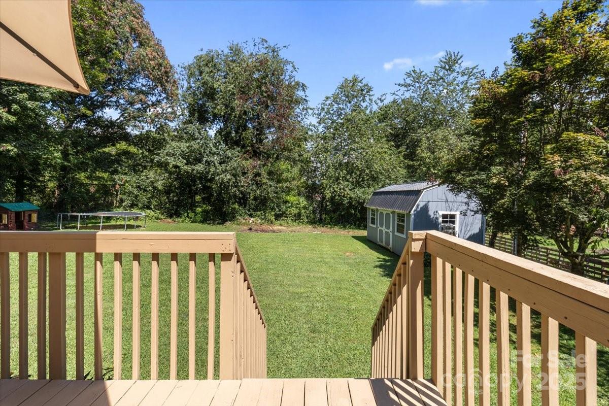 132 Bailey Mountain Road Mars Hill, NC 28754 - Photo 6 of 33 a balcony with wooden floor and fence