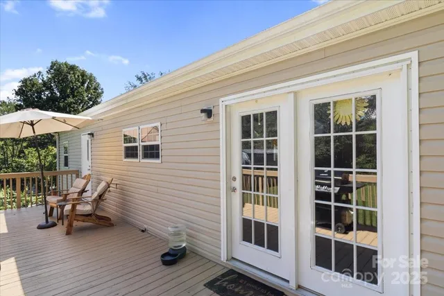 a balcony with chairs and table