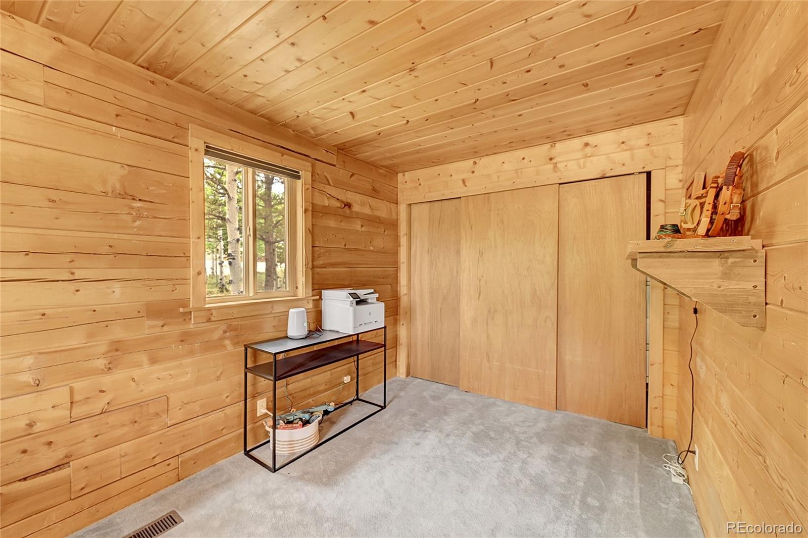 174 Saddlestring Road Bailey, CO 80421 - Photo 12 of 15 a view of a room with windows