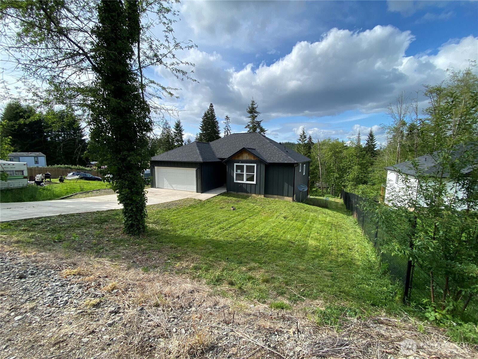 118 Timberline Drive Castle Rock, WA 98611 - Photo 4 of 23 a front view of a house with garden