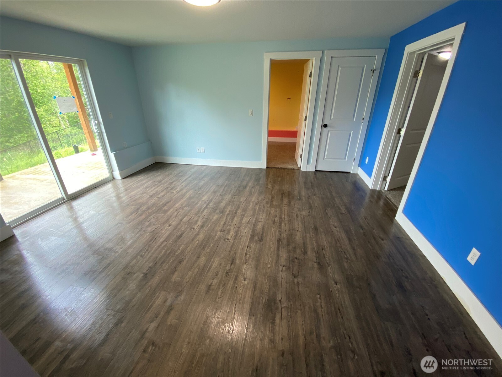 118 Timberline Drive Castle Rock, WA 98611 - Photo 6 of 23 a view of an empty room with wooden floor and a window