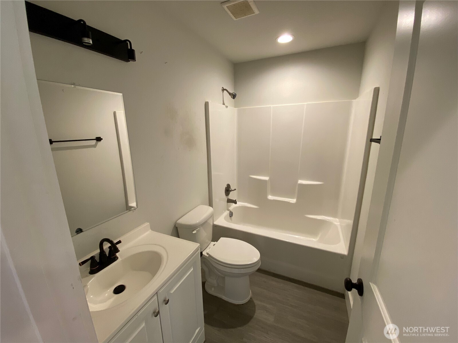 118 Timberline Drive Castle Rock, WA 98611 - Photo 7 of 23 a bathroom with a sink a toilet and a mirror