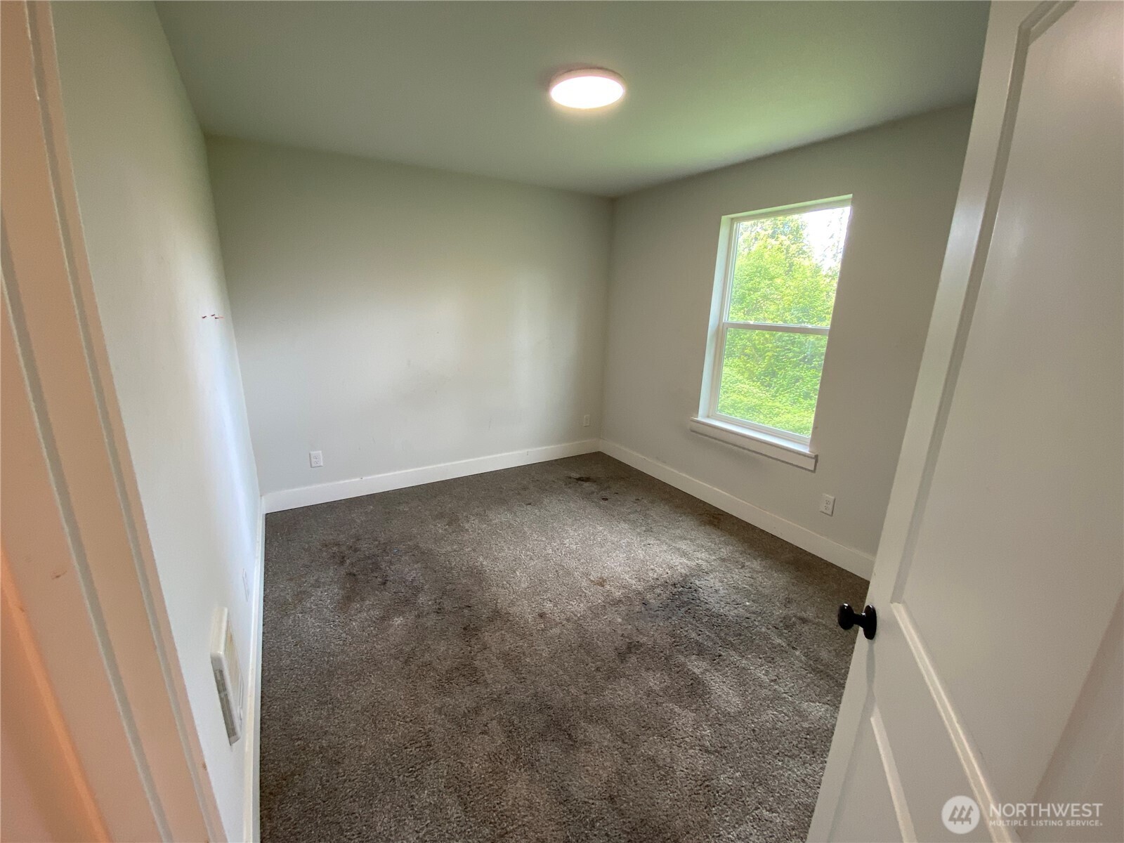 118 Timberline Drive Castle Rock, WA 98611 - Photo 8 of 23 an empty room with a window