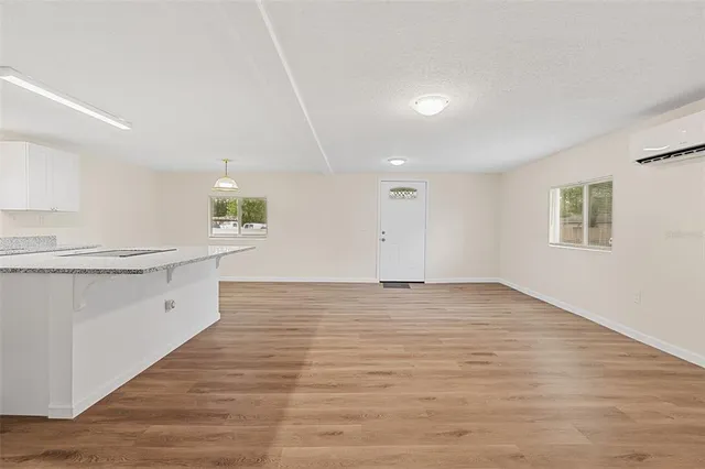 a view of a kitchen cabinets and wooden floor