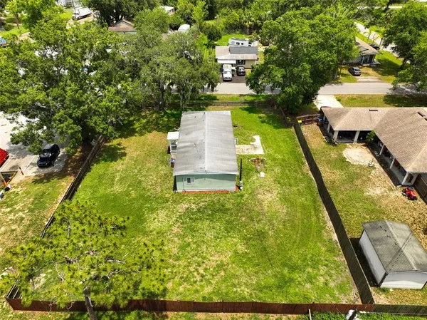 a view of a yard with chairs