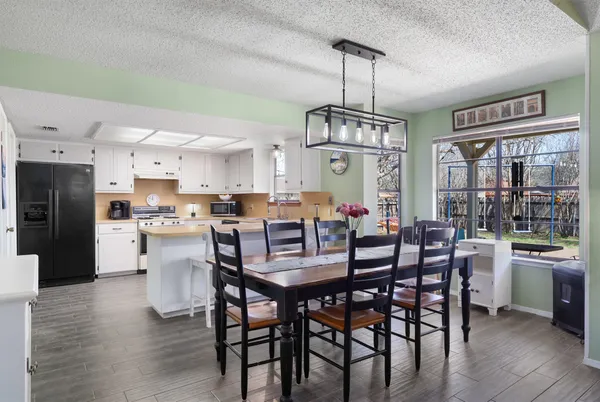 a view of a dining room with furniture