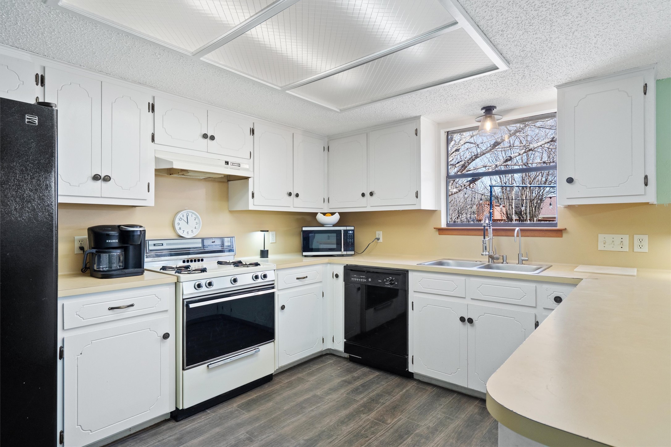 3309 Buffalo Springs Trail Georgetown, TX 78628 - Photo 14 of 36 a kitchen with cabinets stainless steel appliances and wooden floor