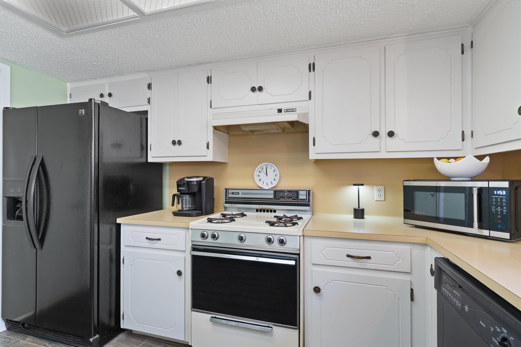 3309 Buffalo Springs Trail Georgetown, TX 78628 - Photo 17 of 36 a kitchen with cabinets stainless steel appliances and sink