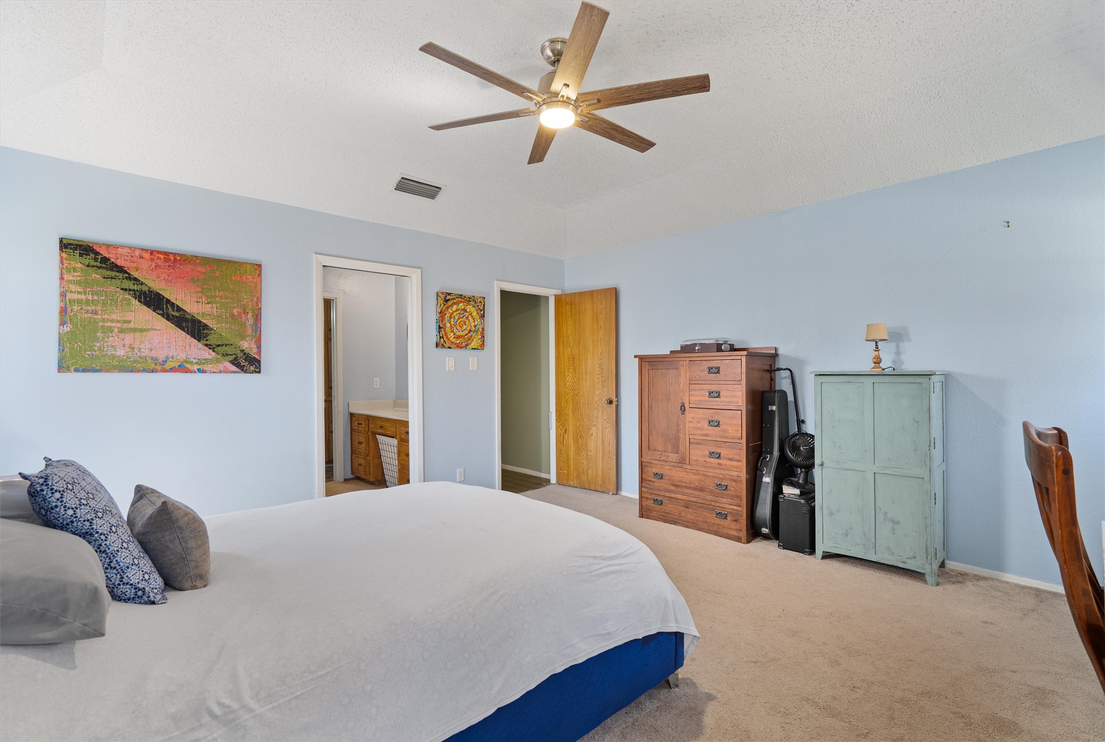 3309 Buffalo Springs Trail Georgetown, TX 78628 - Photo 19 of 36 a bedroom with a bed and a refrigerator