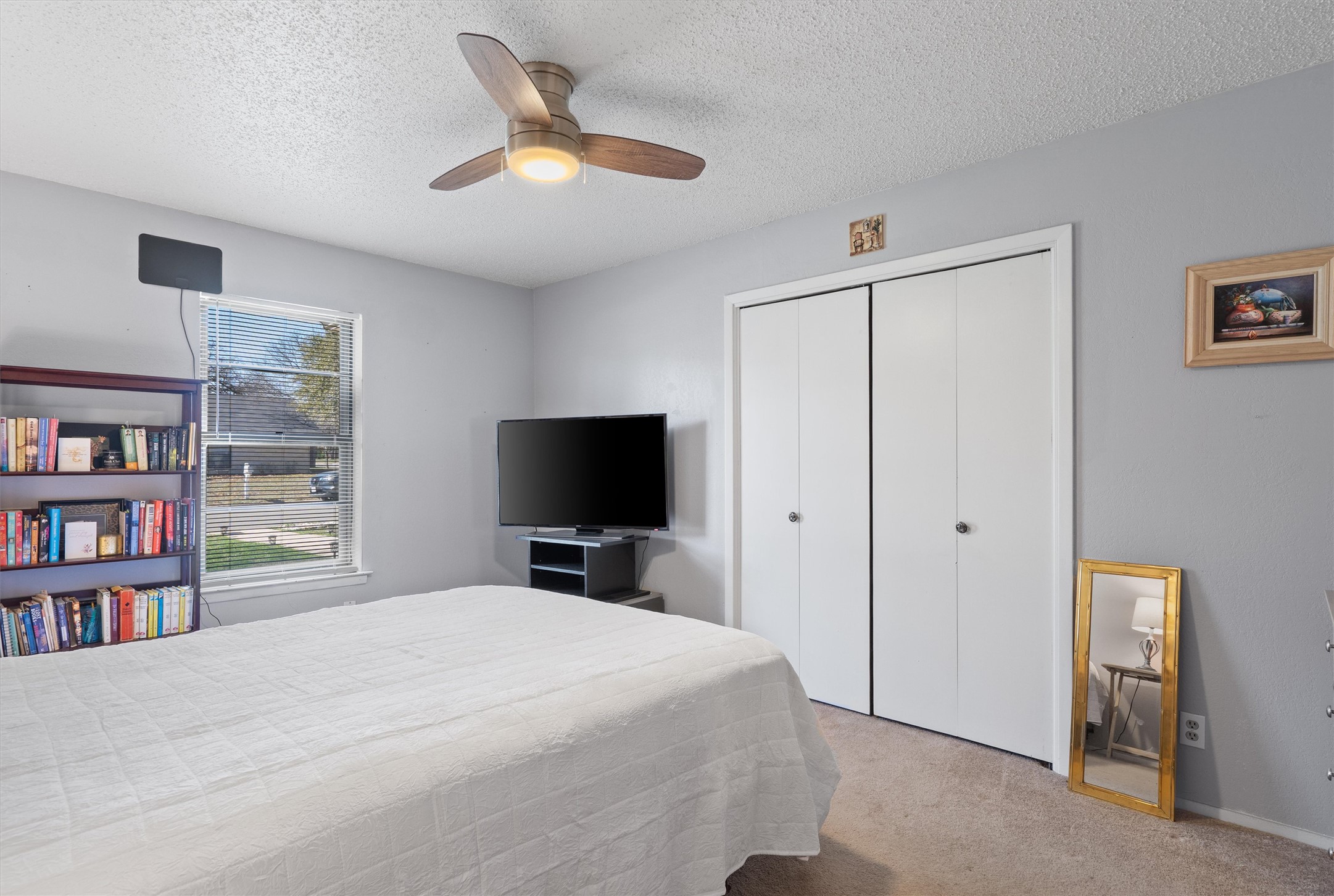 3309 Buffalo Springs Trail Georgetown, TX 78628 - Photo 23 of 36 a bedroom with a bed and a flat screen tv