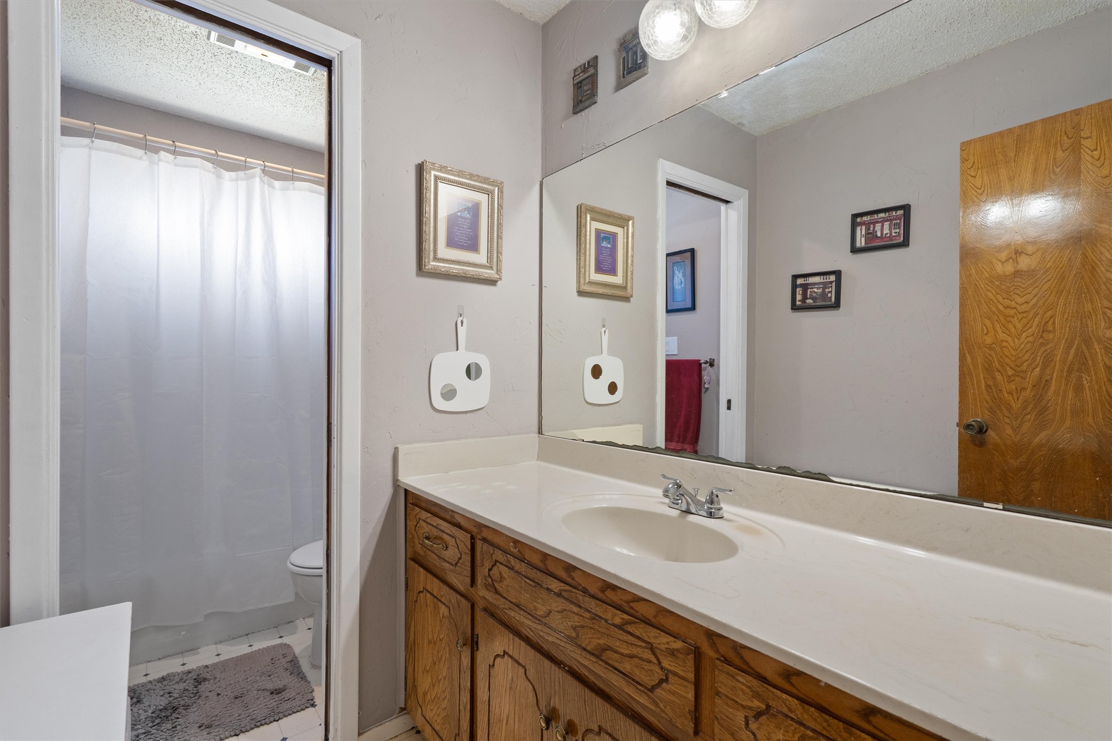 3309 Buffalo Springs Trail Georgetown, TX 78628 - Photo 25 of 36 a bathroom with a granite countertop sink toilet and shower