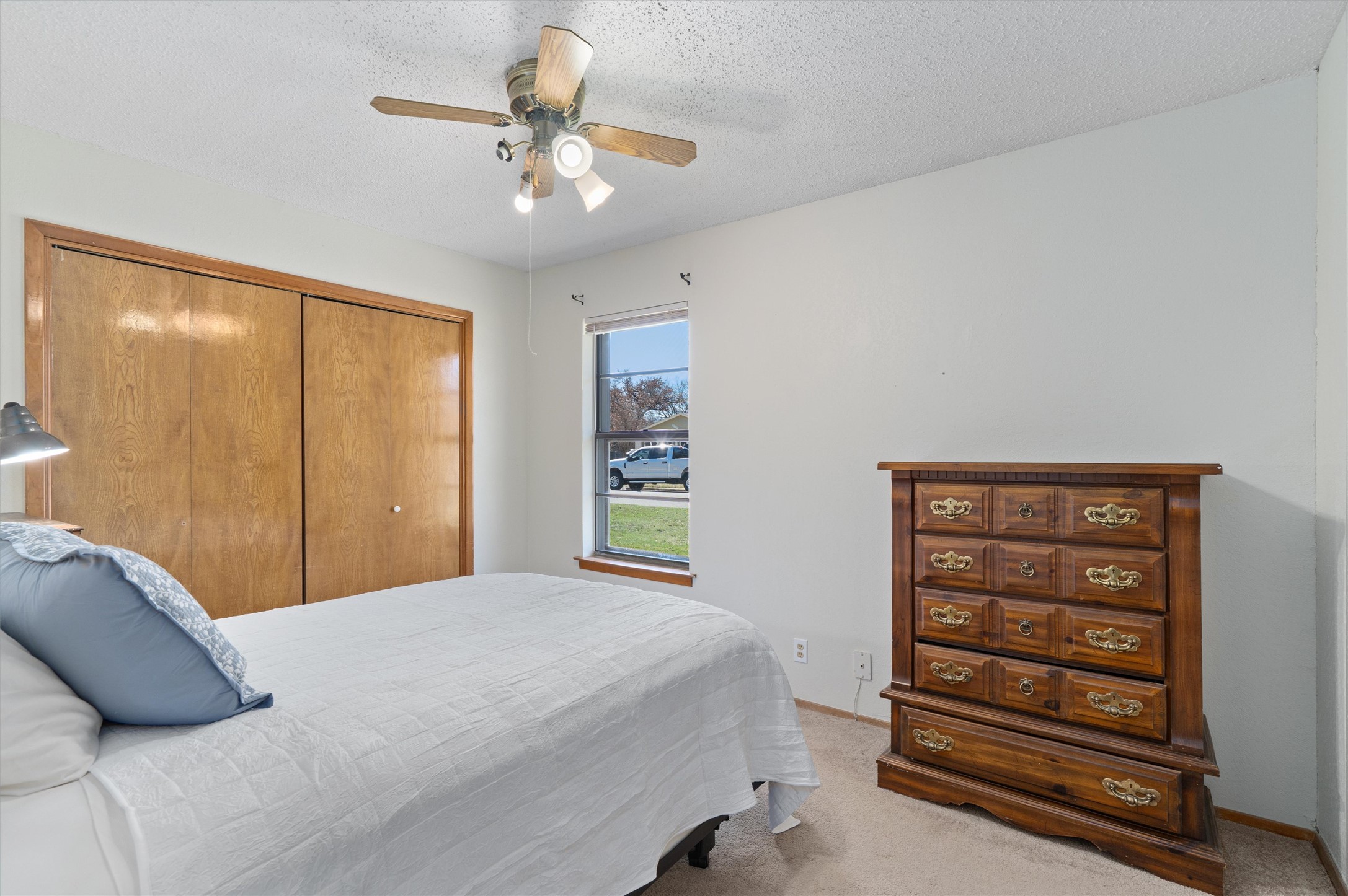 3309 Buffalo Springs Trail Georgetown, TX 78628 - Photo 26 of 36 a bedroom with a bed and a chandelier