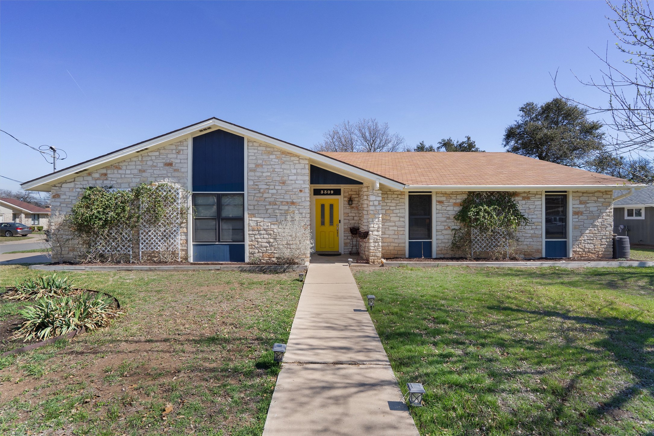 3309 Buffalo Springs Trail Georgetown, TX 78628 - Photo 3 of 36 a front view of a house with a garden