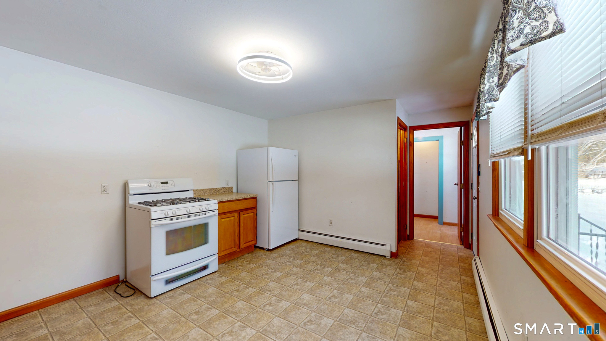 19 Plaza Street Brooklyn, CT 06234 - Photo 13 of 33 a view of a kitchen with stainless steel appliances granite countertop a stove and a refrigerator