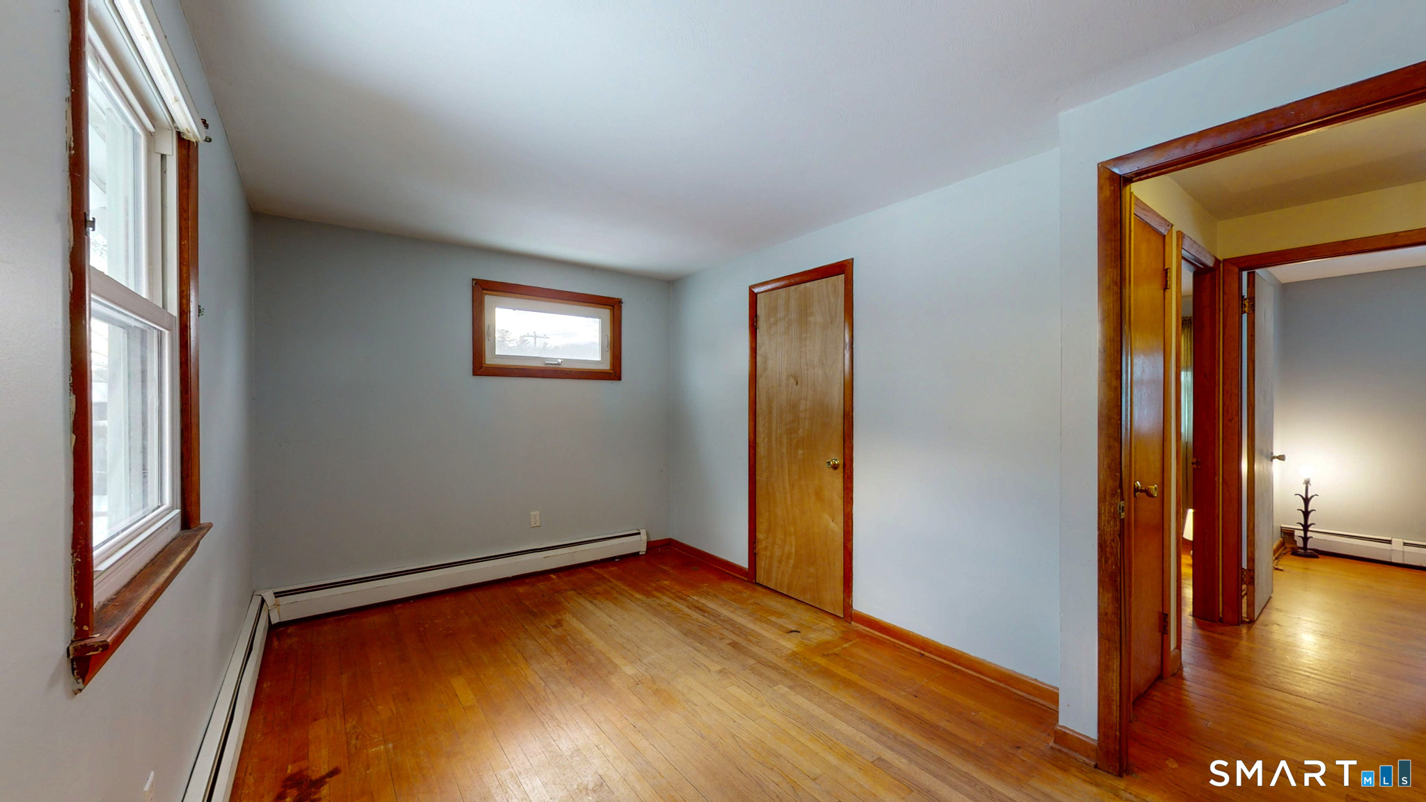 19 Plaza Street Brooklyn, CT 06234 - Photo 15 of 33 a view of empty room with wooden floor and windows
