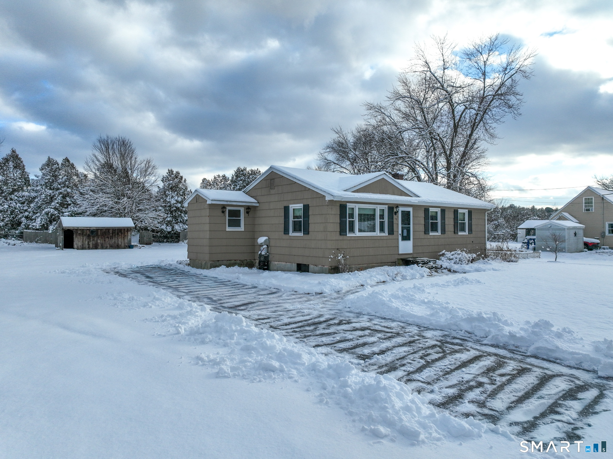 19 Plaza Street Brooklyn, CT 06234 - Photo 2 of 33 a front view of a house with a yard