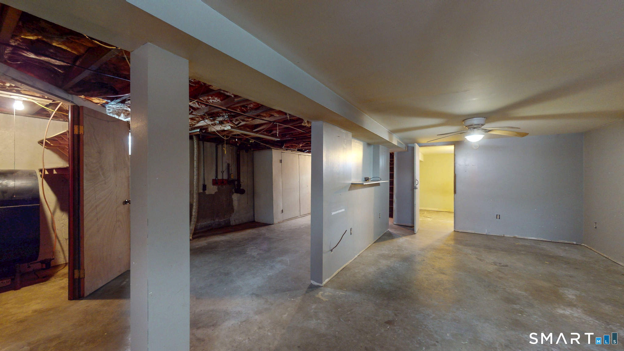 19 Plaza Street Brooklyn, CT 06234 - Photo 25 of 33 a view of a hallway with wooden shelves