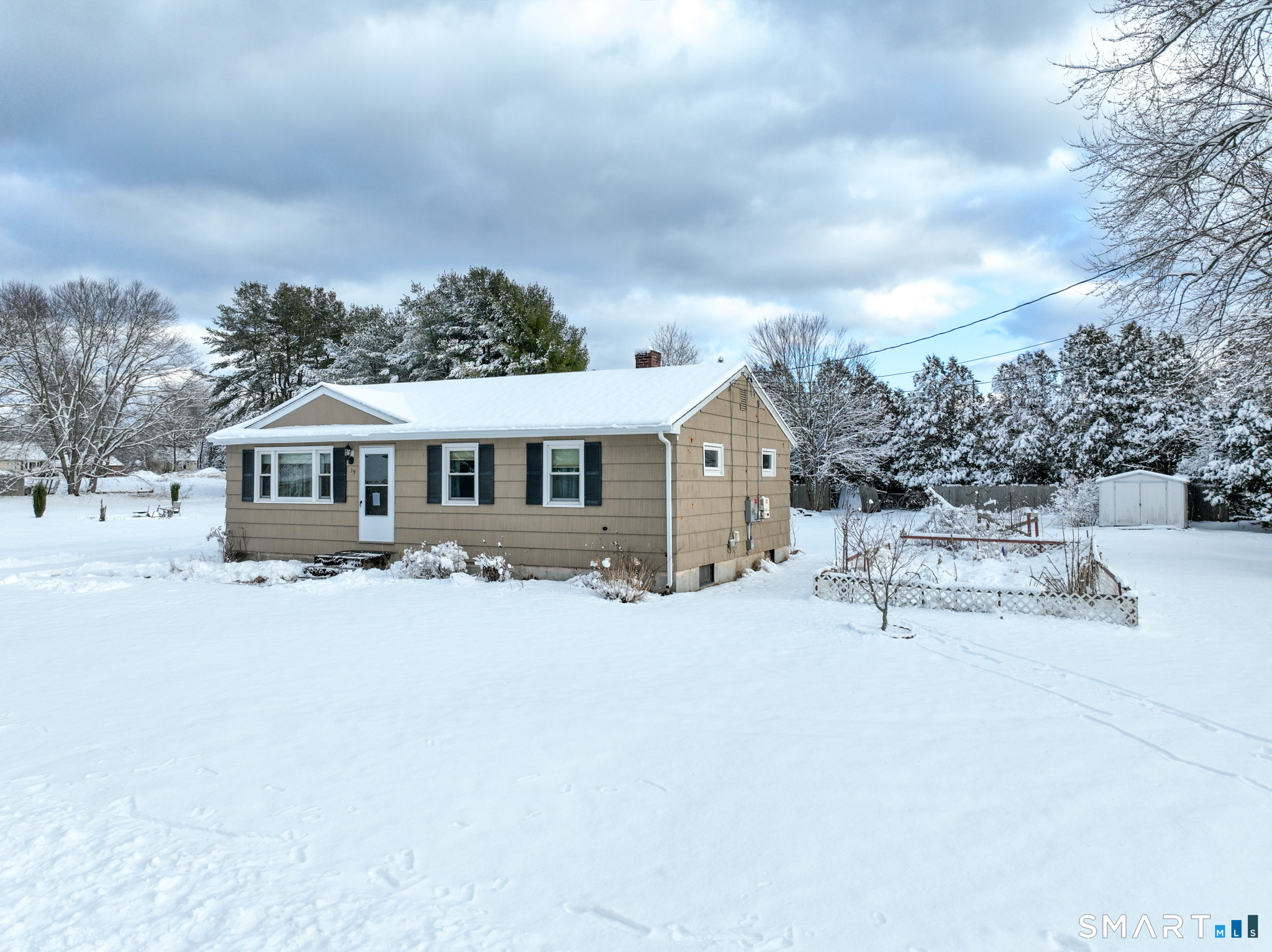 19 Plaza Street Brooklyn, CT 06234 - Photo 3 of 33 a white house with a large tree in front of it