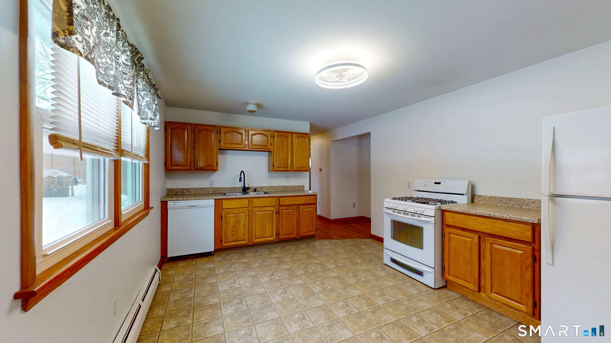 19 Plaza Street Brooklyn, CT 06234 - Photo 10 of 33 a kitchen with stainless steel appliances granite countertop a stove a sink dishwasher and a refrigerator