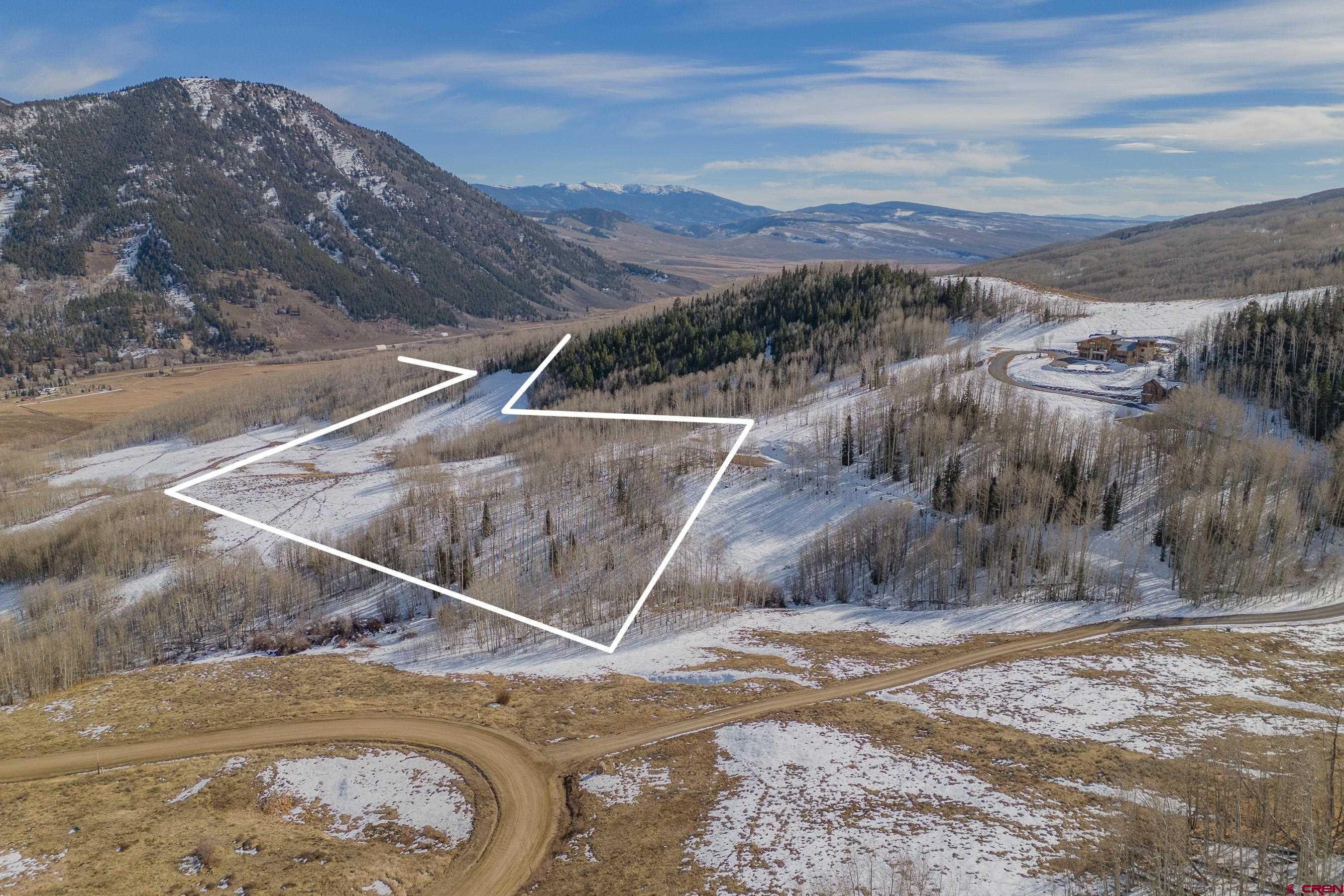1363 Red Mountain Ranch Road Crested Butte, CO 81224 - Photo 18 of 38 a view of a backyard with wooden fence