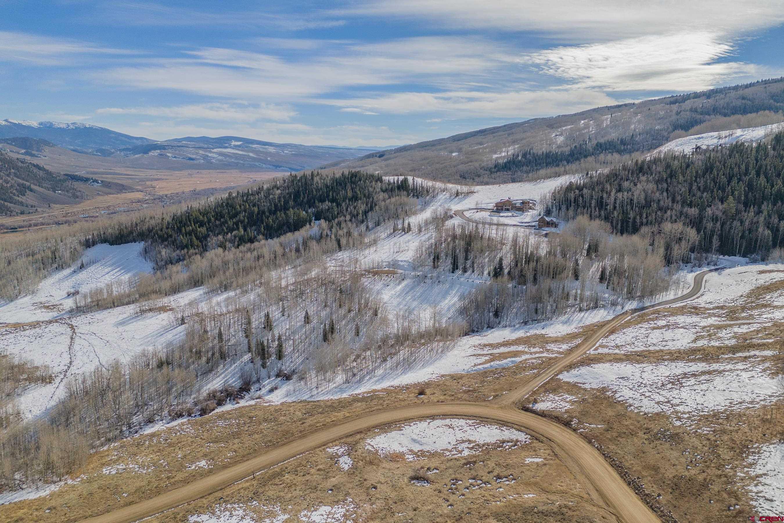 1363 Red Mountain Ranch Road Crested Butte, CO 81224 - Photo 3 of 38 a view of a dry yard with wooden fence