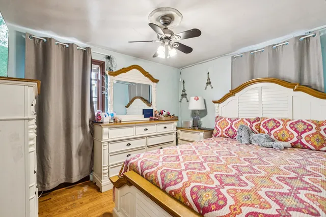 a bedroom with a bed and a dresser