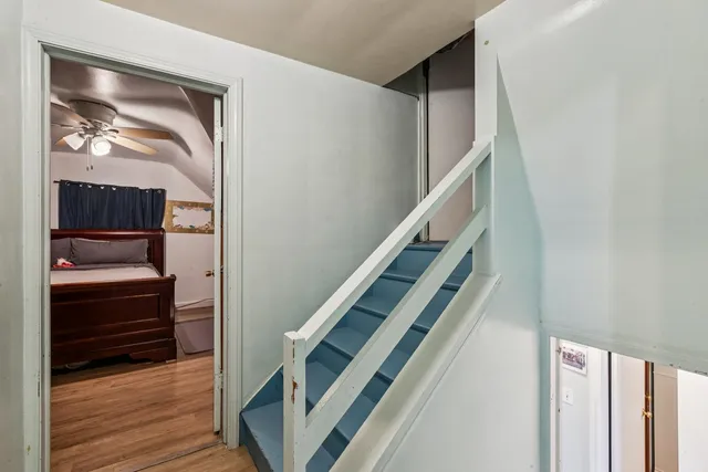 a view of entryway and hall with wooden floor