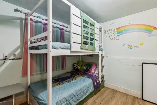 a bed room with a bed and a book shelf