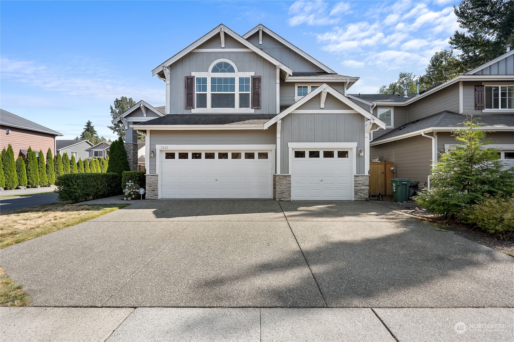 3412 171st Place Southeast Bothell, WA 98012 - Photo 1 of 40 a front view of a house with a yard