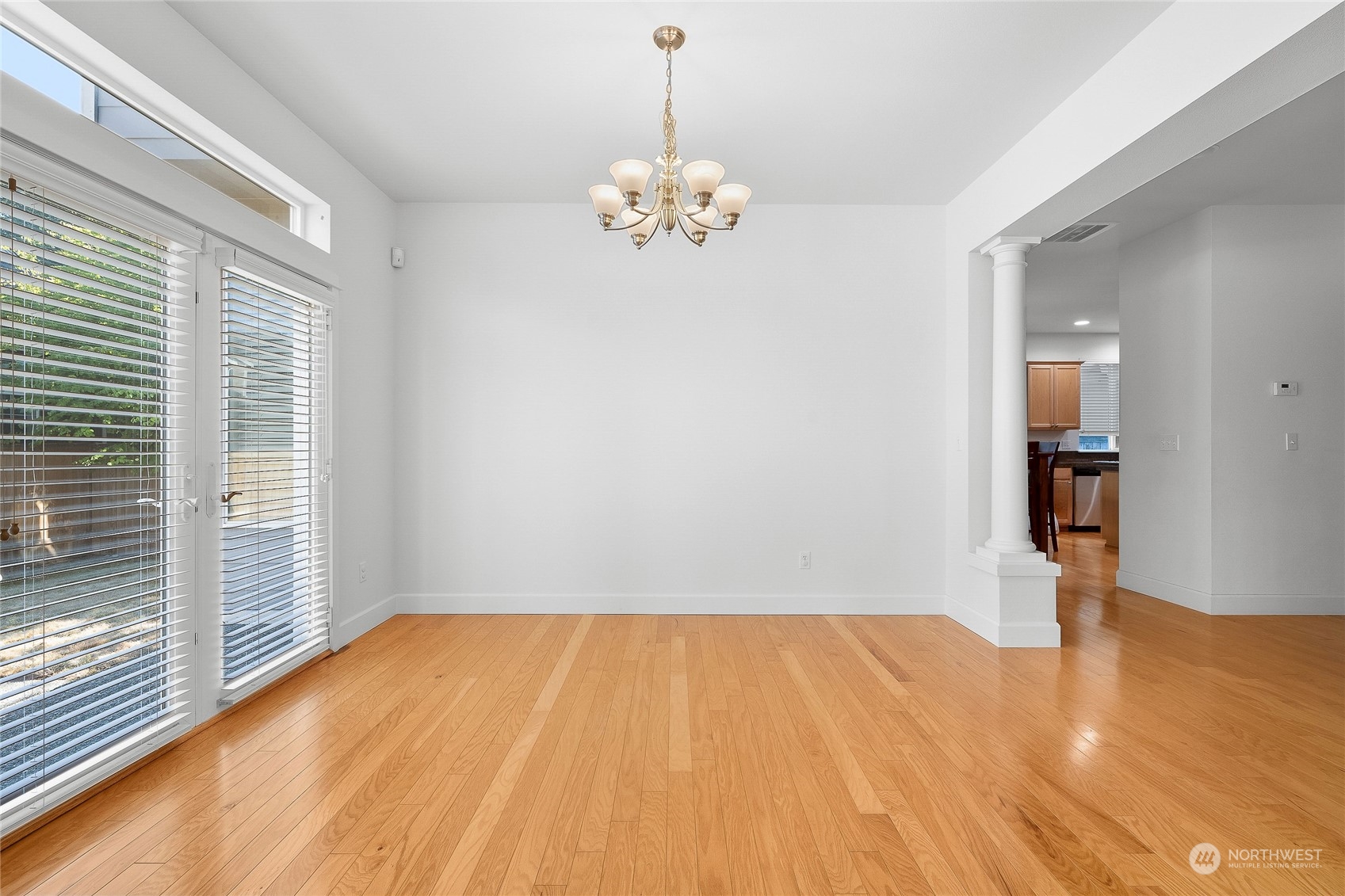 3412 171st Place Southeast Bothell, WA 98012 - Photo 11 of 40 a view of empty room with wooden floor and fan
