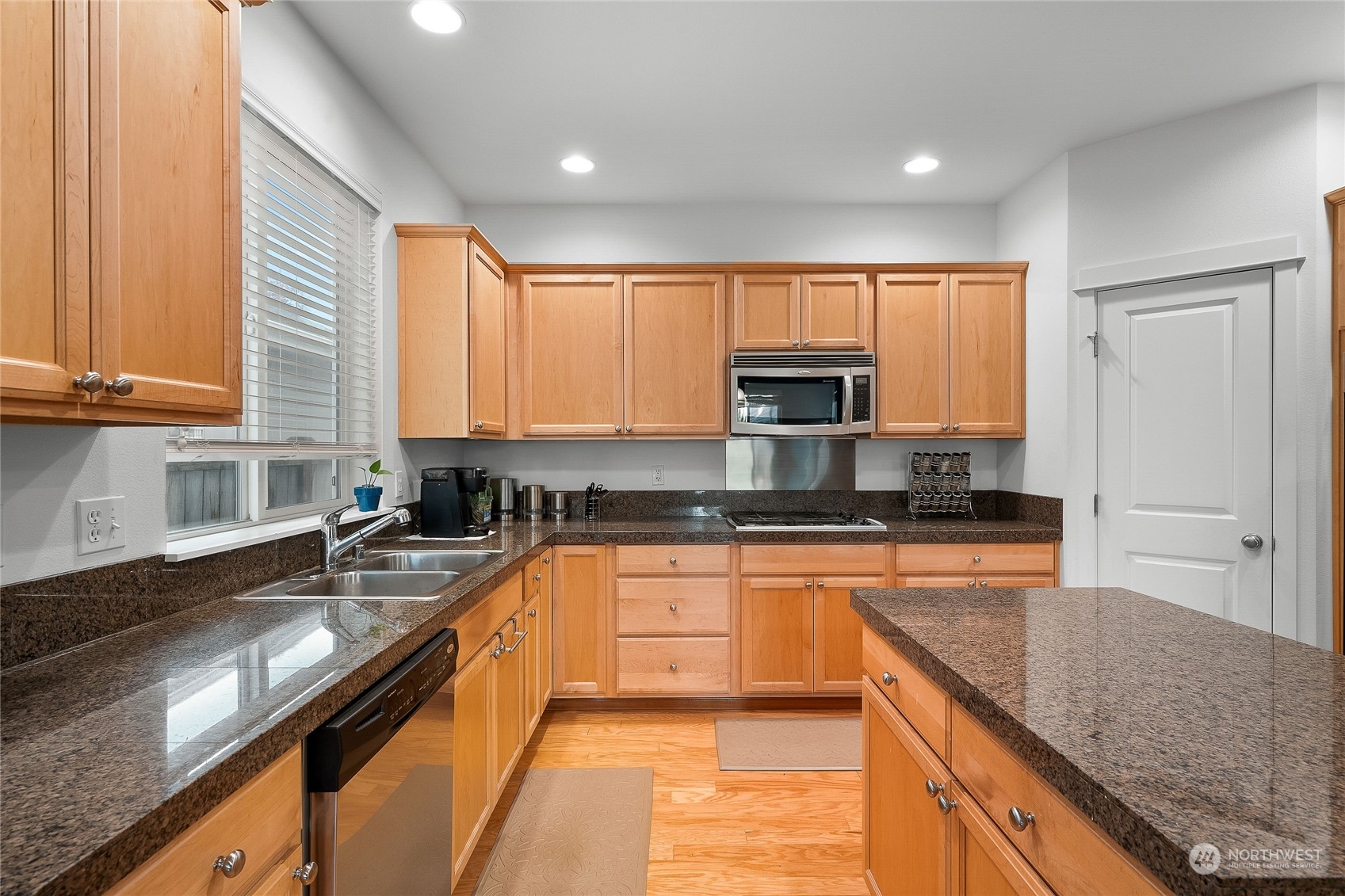 3412 171st Place Southeast Bothell, WA 98012 - Photo 13 of 40 a kitchen with stainless steel appliances granite countertop a sink a stove and cabinets