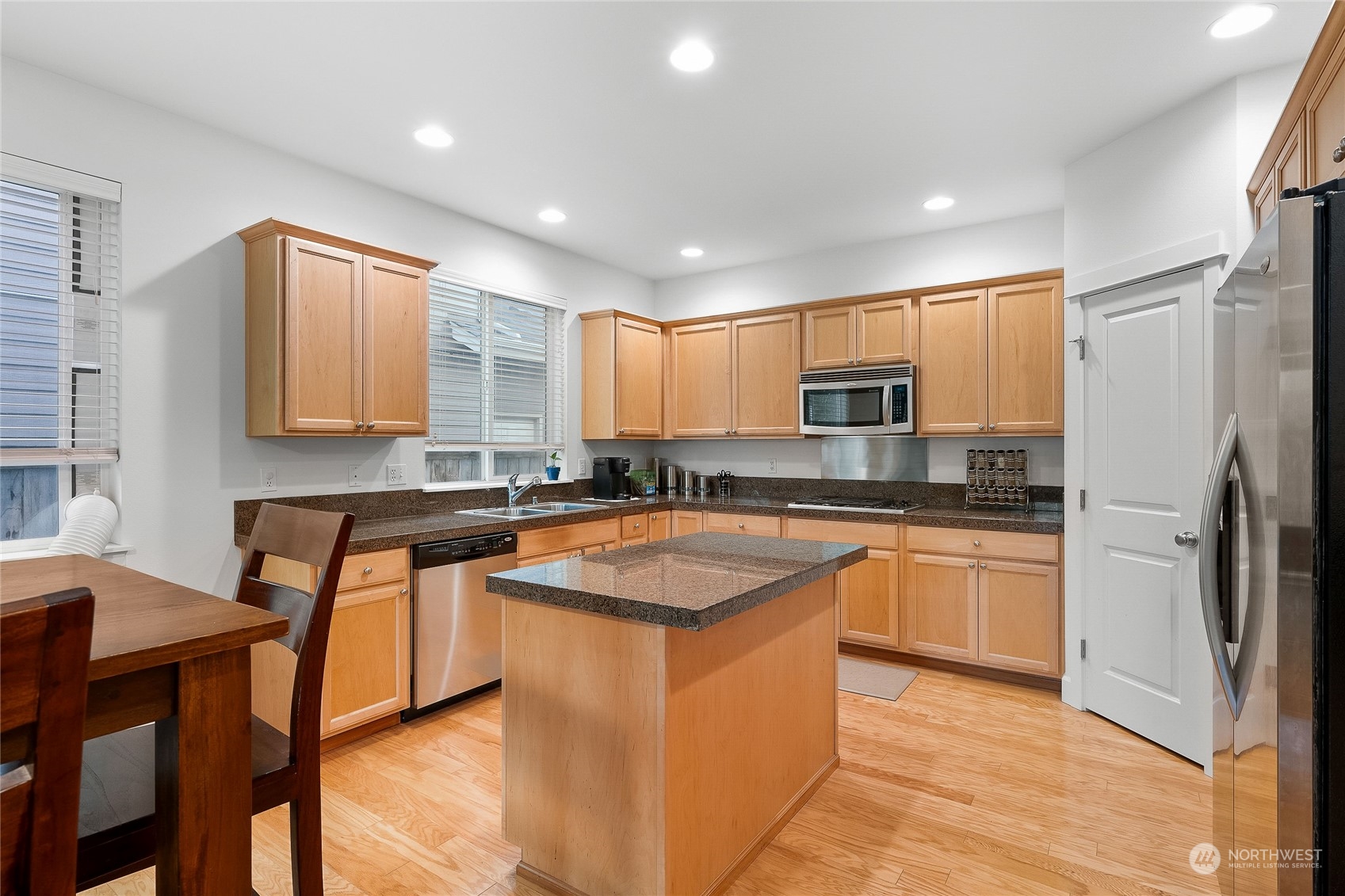 3412 171st Place Southeast Bothell, WA 98012 - Photo 14 of 40 a kitchen with stainless steel appliances granite countertop sink stove top oven and refrigerator