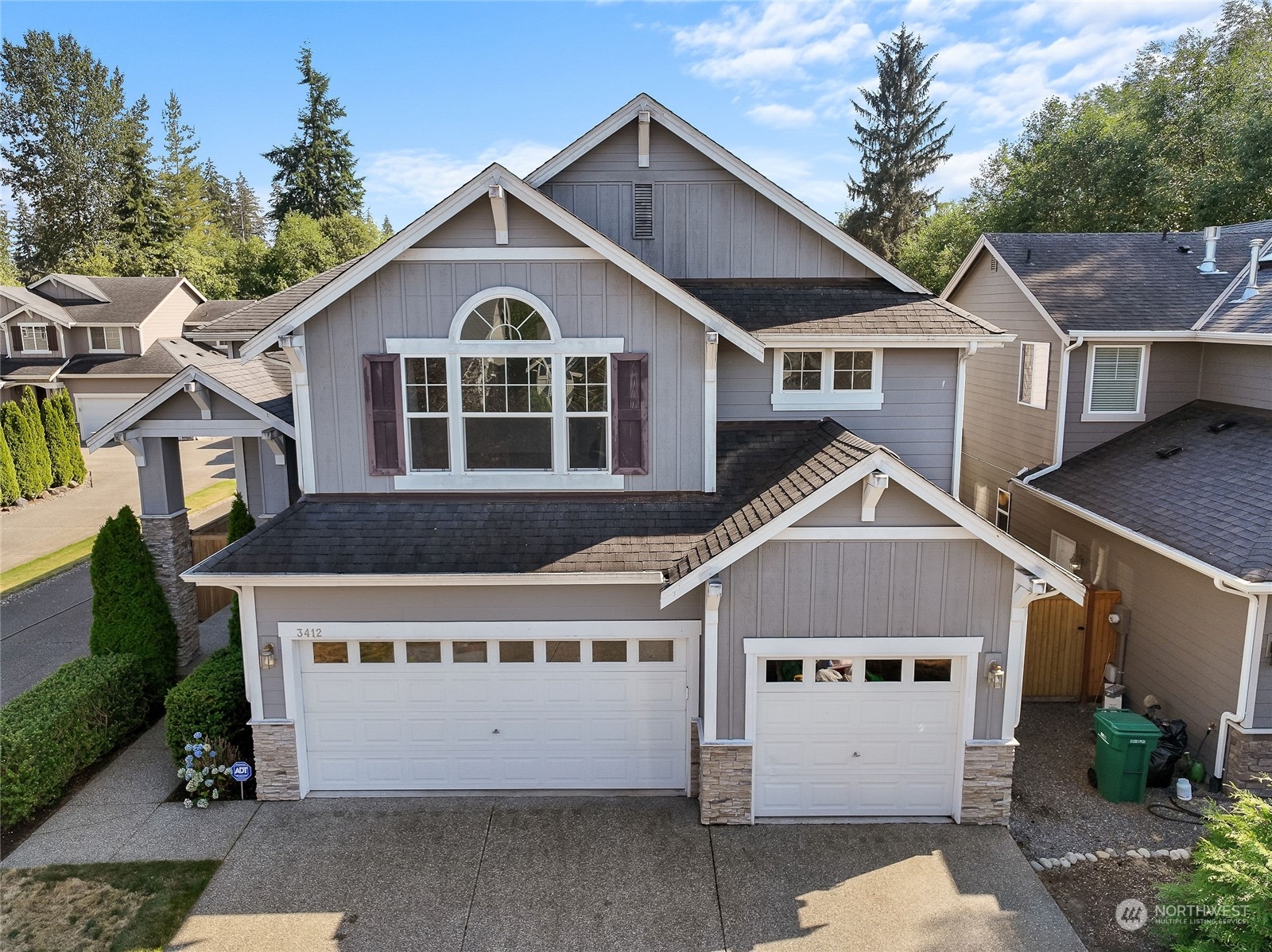 3412 171st Place Southeast Bothell, WA 98012 - Photo 2 of 40 a front view of a house with a yard