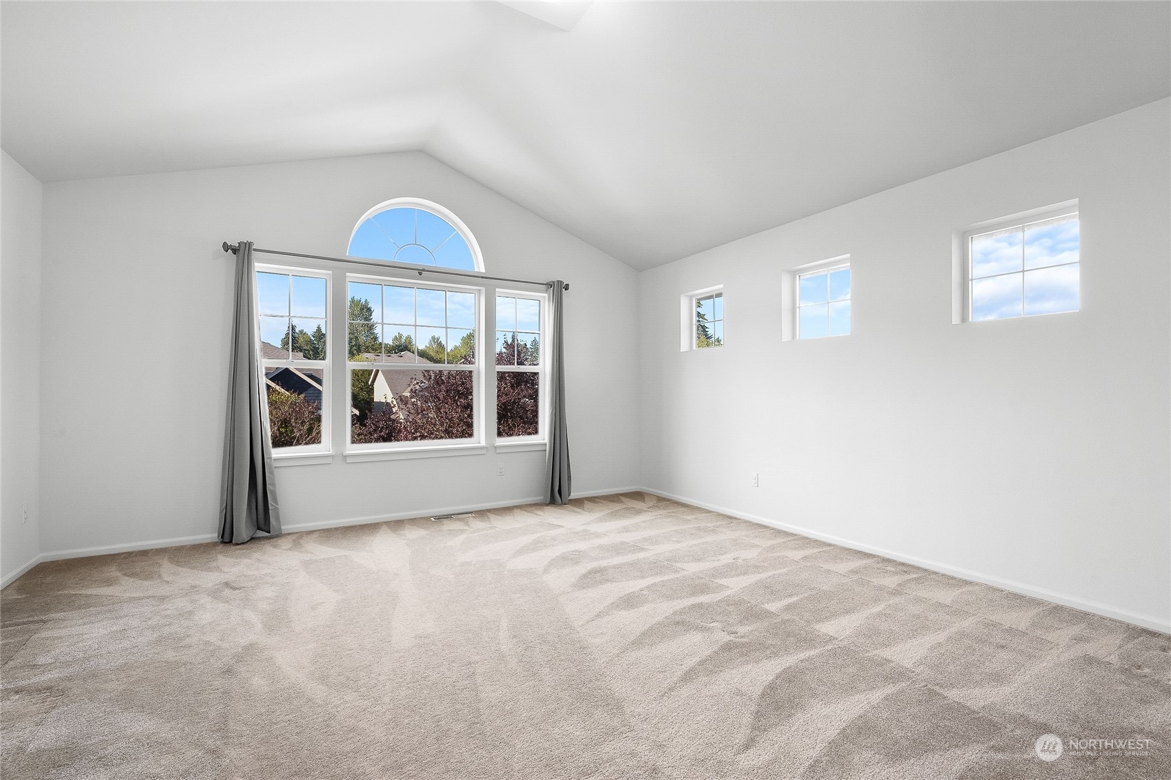 3412 171st Place Southeast Bothell, WA 98012 - Photo 22 of 40 a view of a big room with windows and chandelier fan