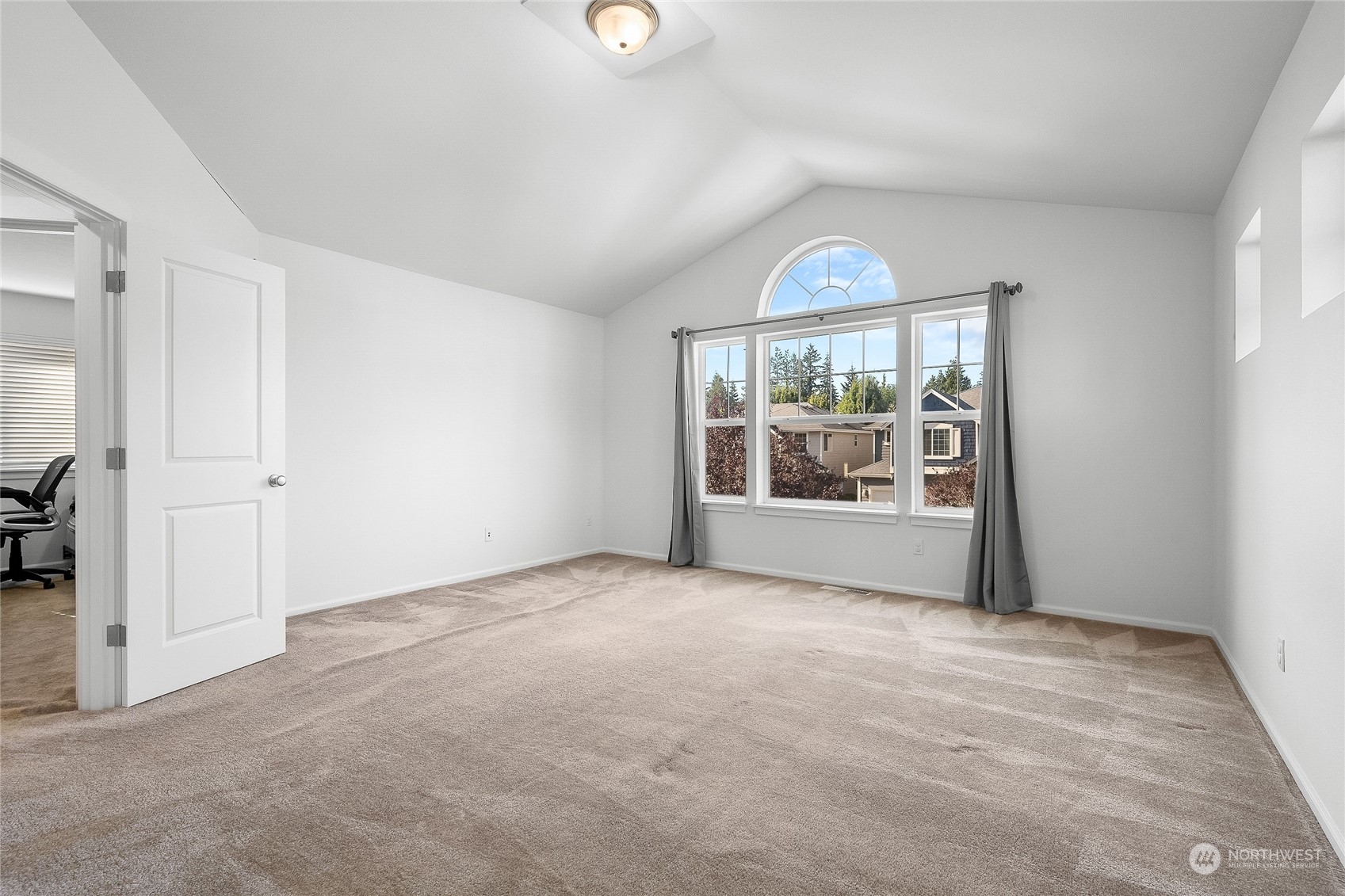 3412 171st Place Southeast Bothell, WA 98012 - Photo 23 of 40 an empty room with windows and chandelier