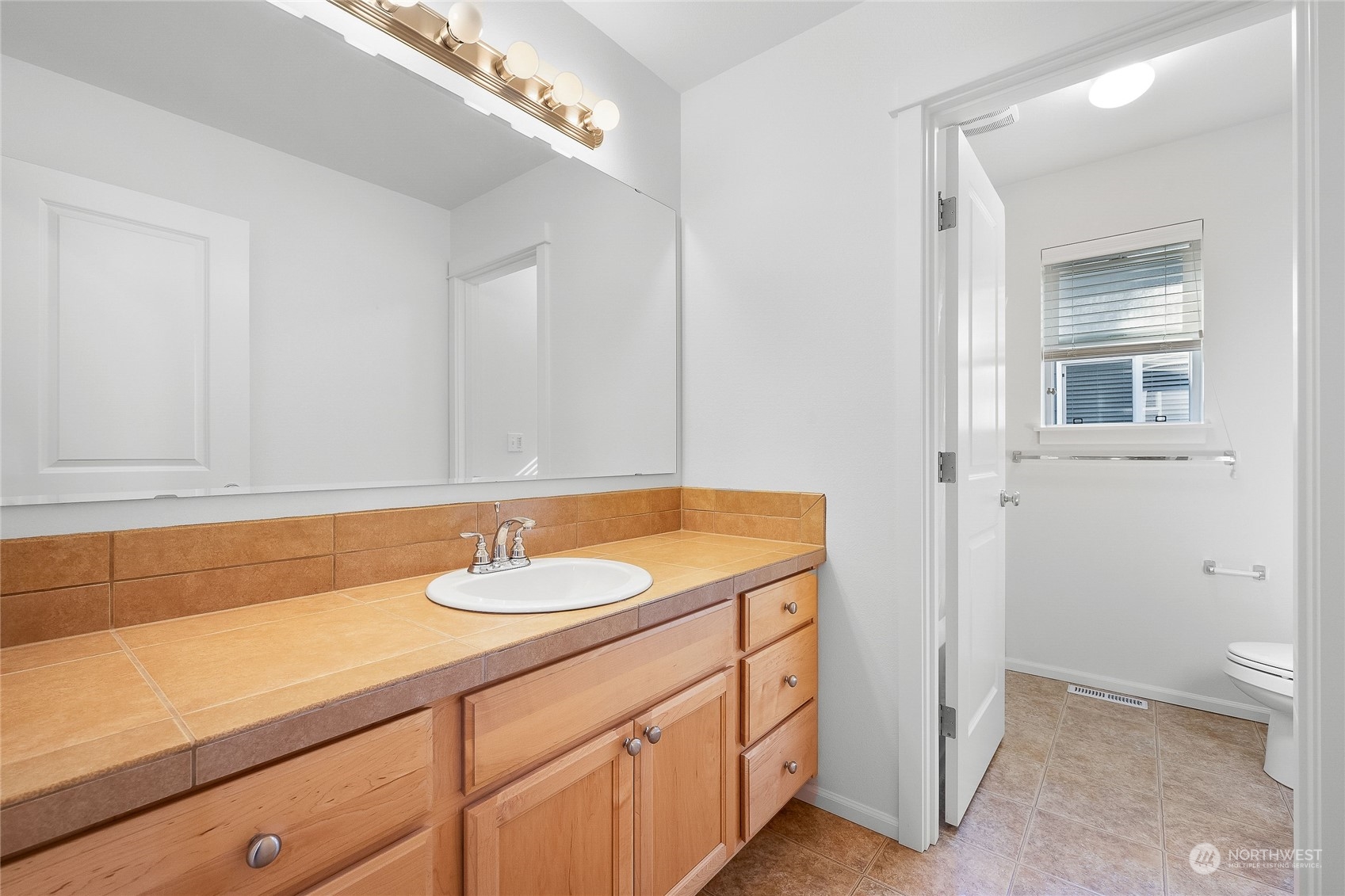 3412 171st Place Southeast Bothell, WA 98012 - Photo 25 of 40 a bathroom with a sink and a mirror