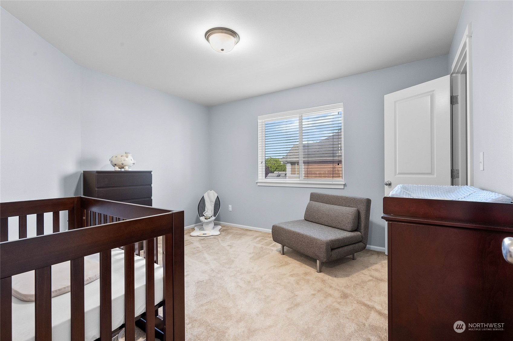 3412 171st Place Southeast Bothell, WA 98012 - Photo 27 of 40 a living room with furniture and a window