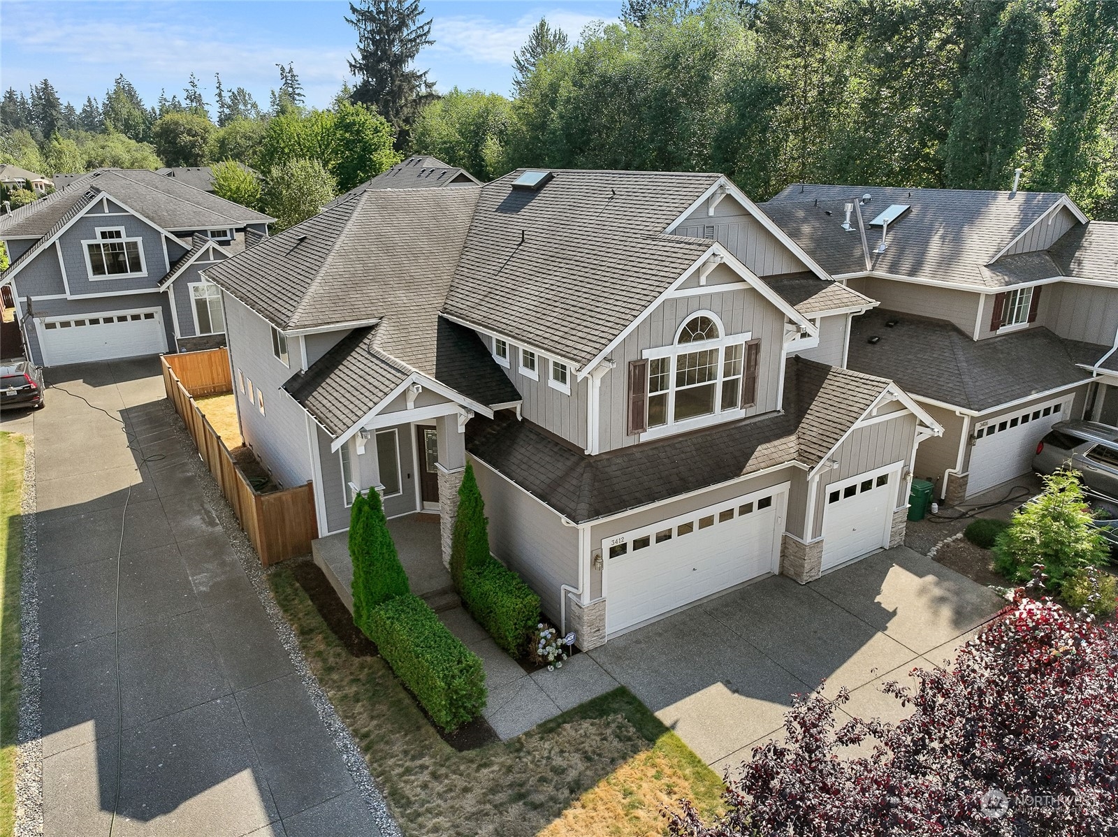 3412 171st Place Southeast Bothell, WA 98012 - Photo 3 of 40 a aerial view of a house with a yard and potted plants