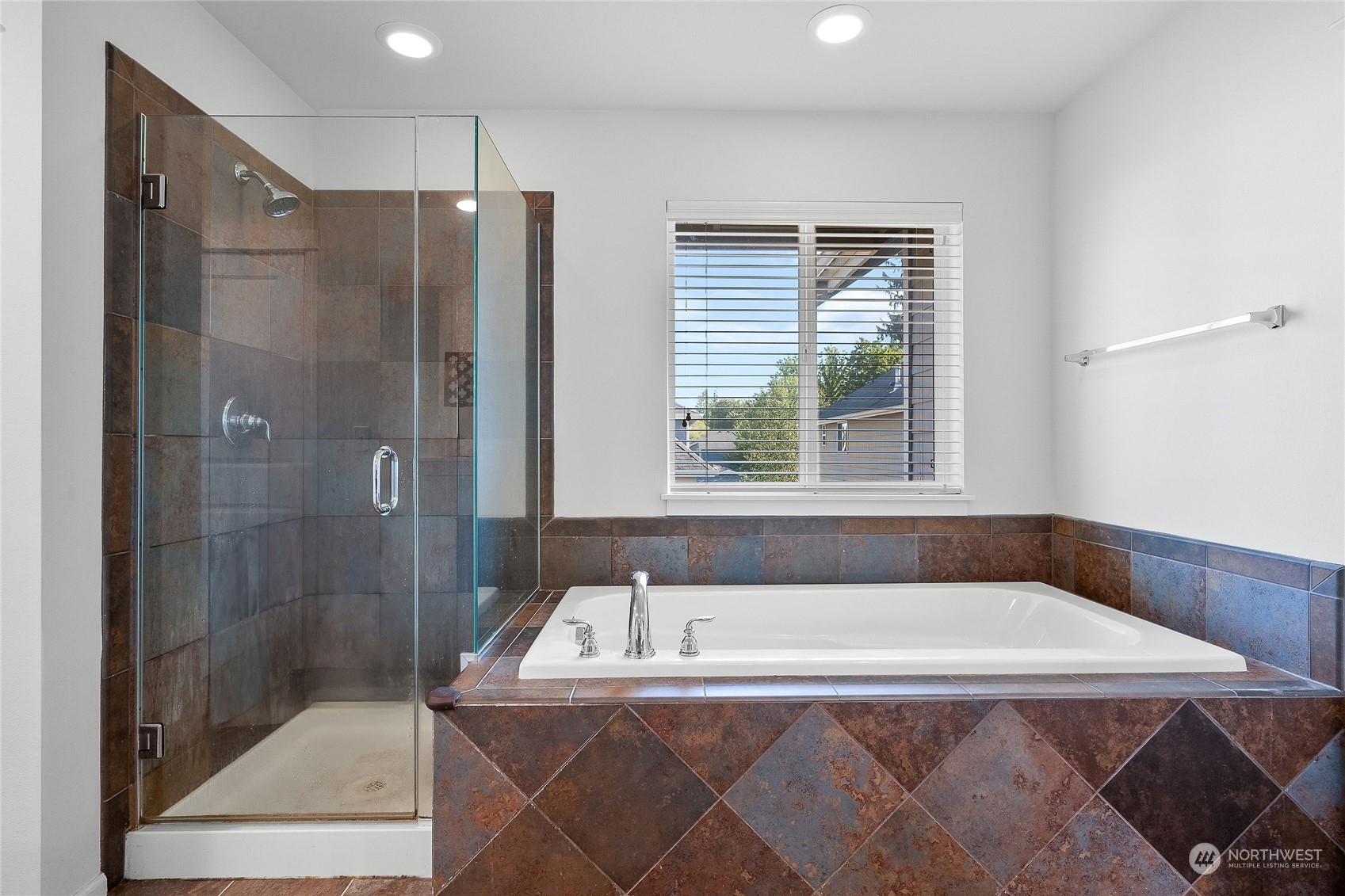 3412 171st Place Southeast Bothell, WA 98012 - Photo 36 of 40 a bathroom with a tub and a shower