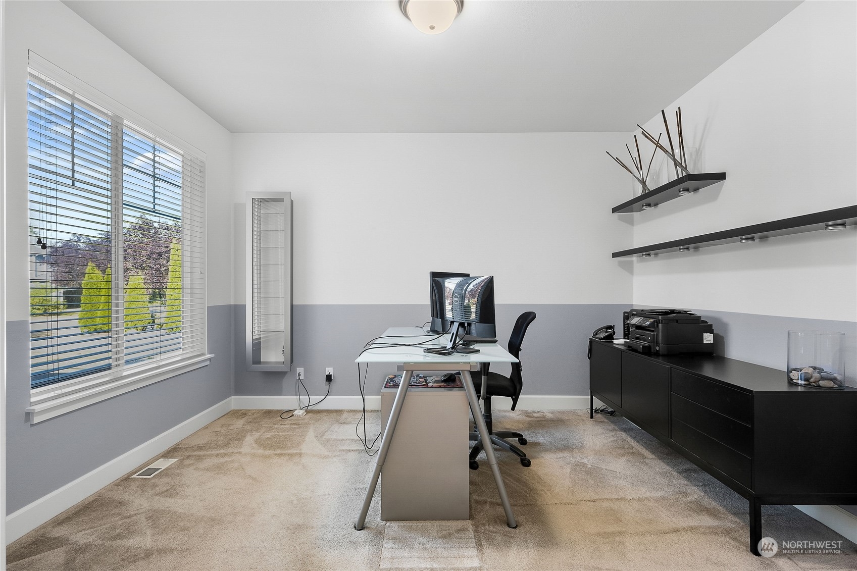 3412 171st Place Southeast Bothell, WA 98012 - Photo 6 of 40 a view of a workspace with furniture and a window