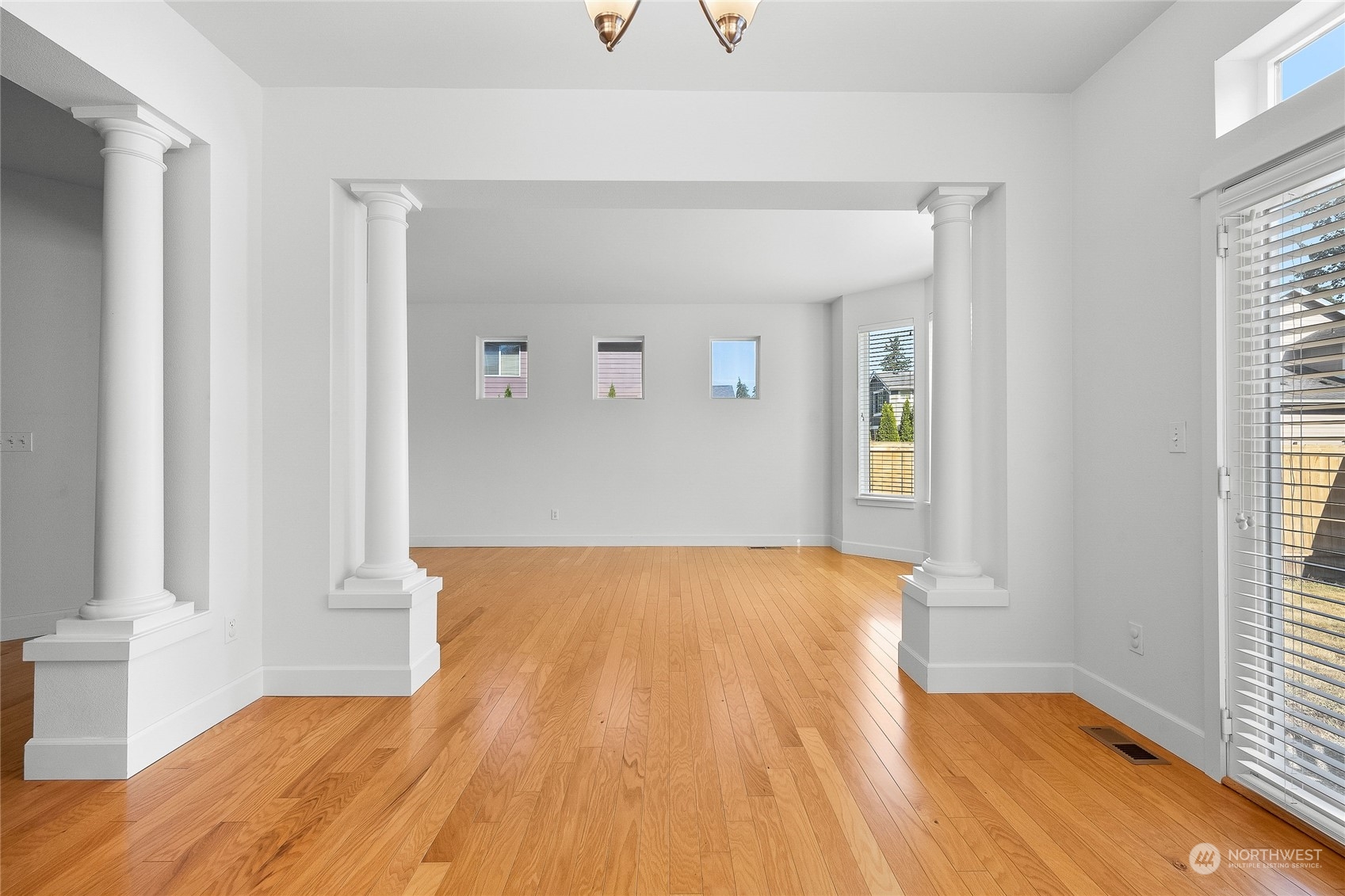 3412 171st Place Southeast Bothell, WA 98012 - Photo 8 of 40 a view of empty room with wooden floor and fan