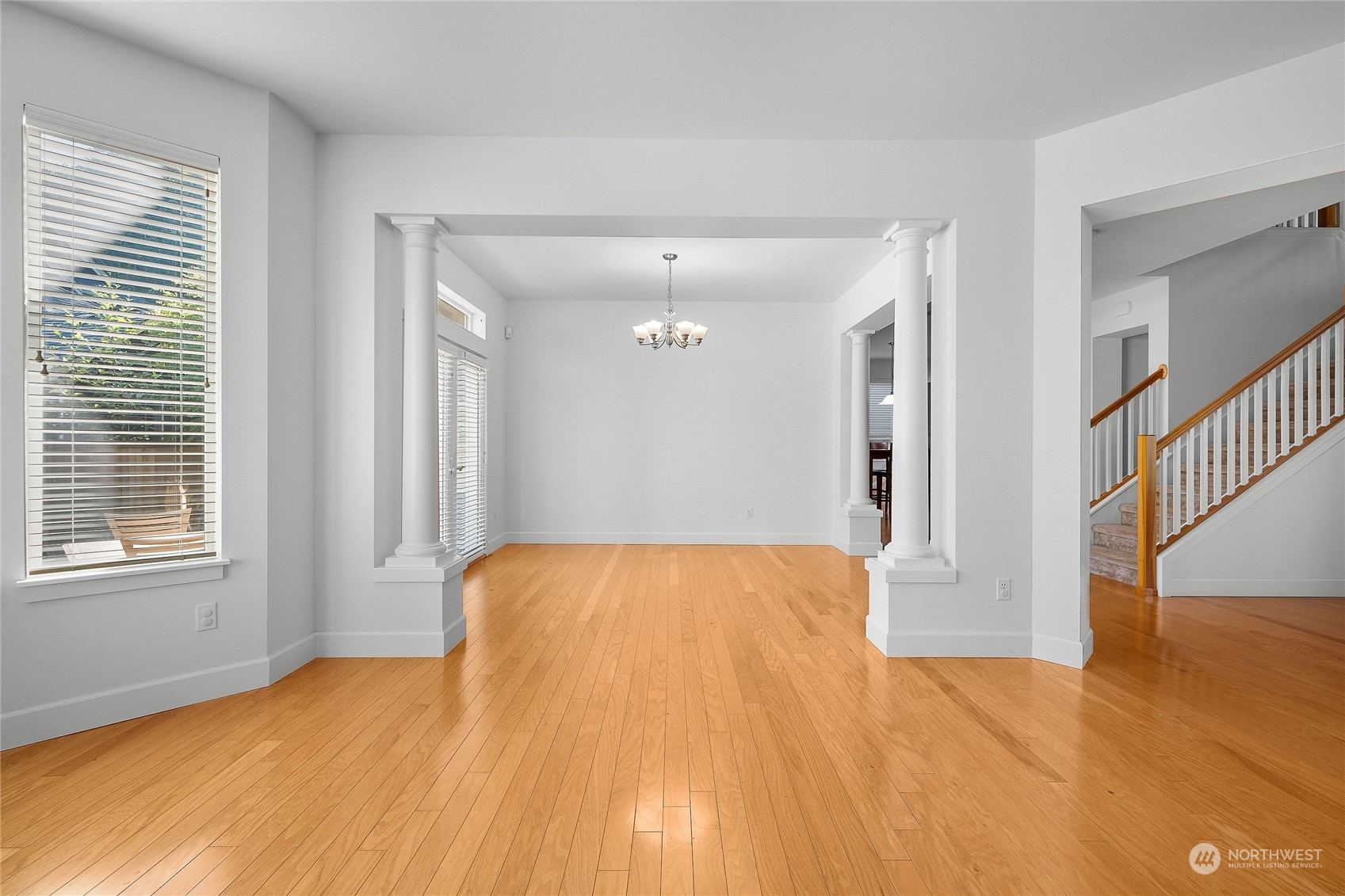 3412 171st Place Southeast Bothell, WA 98012 - Photo 9 of 40 a view of a bedroom with wooden floor and a bathroom