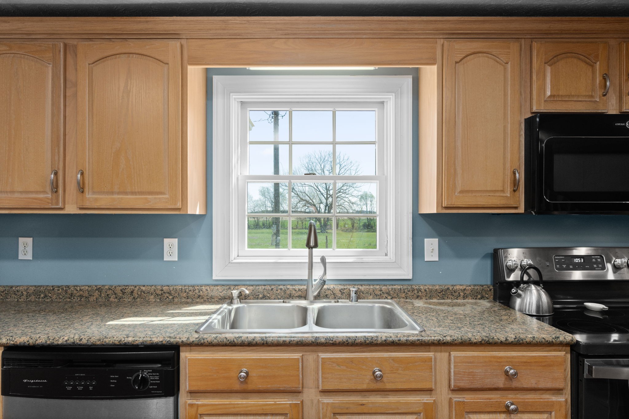 5150 Cadiz Road Hopkinsville, KY 42240 - Photo 13 of 45 a kitchen with granite countertop white cabinets and a sink