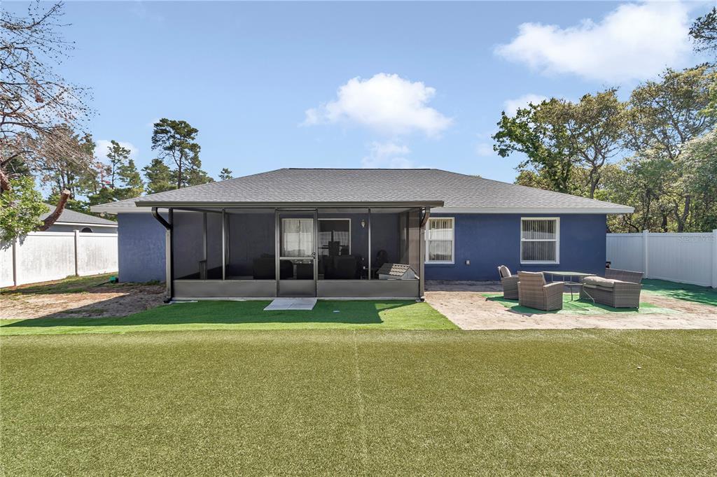 13800 Southwest 33rd Court Road Ocala, FL 34473 - Photo 12 of 42 a house view with a sitting space and garden