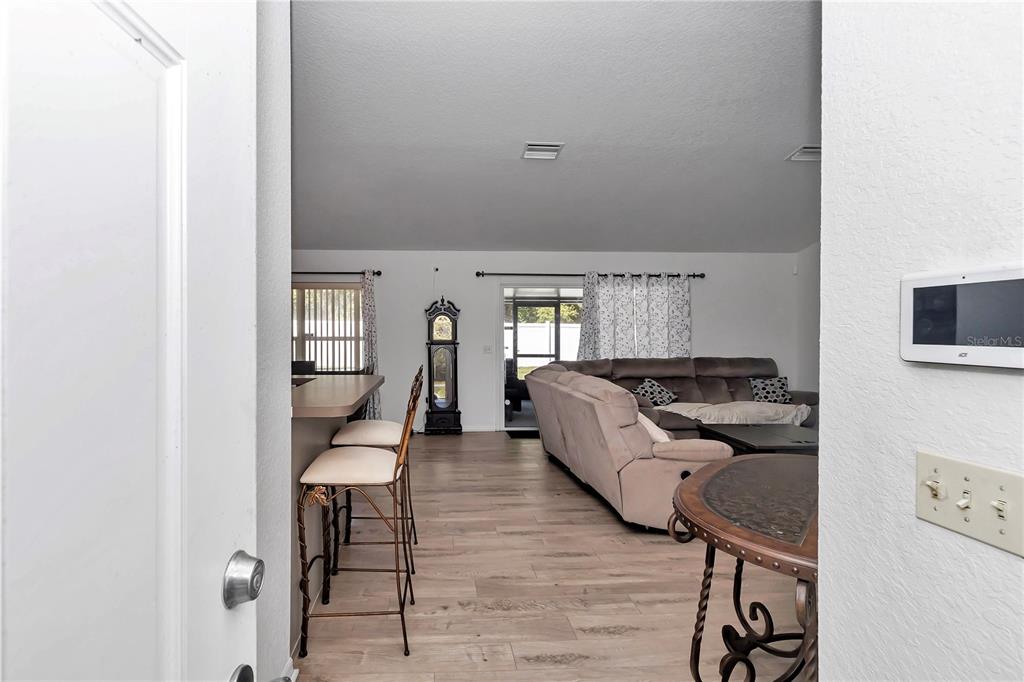 13800 Southwest 33rd Court Road Ocala, FL 34473 - Photo 17 of 42 a living room with furniture and a fireplace