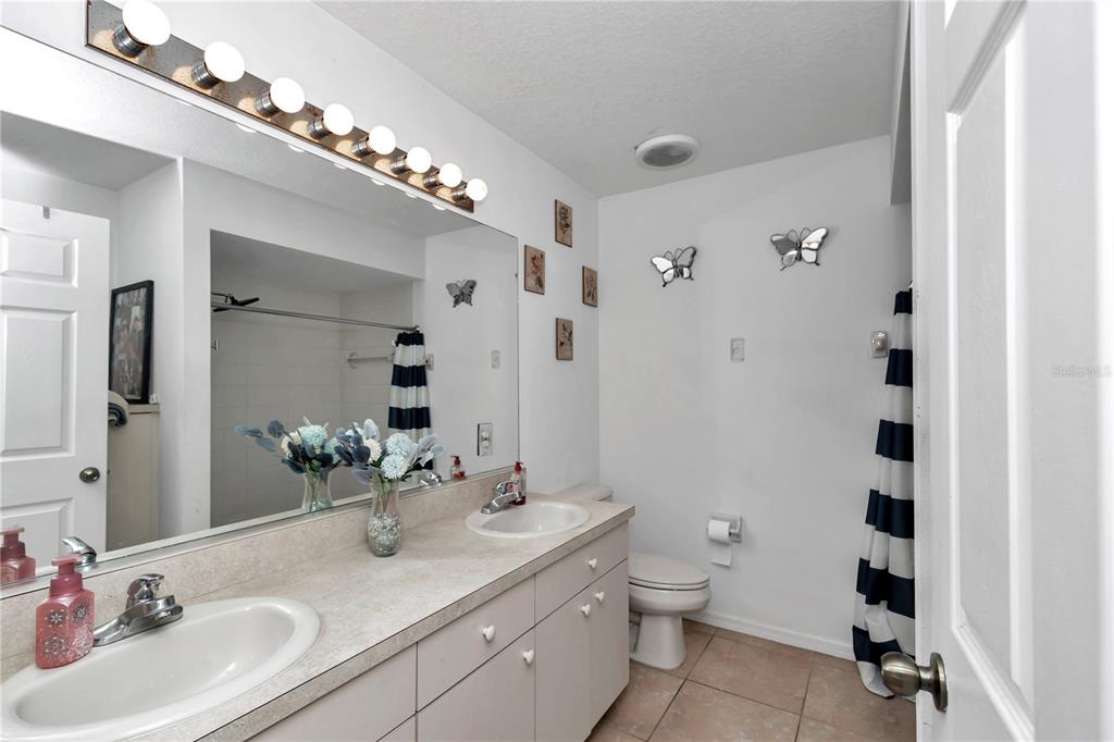 13800 Southwest 33rd Court Road Ocala, FL 34473 - Photo 29 of 42 a bathroom with a sink a toilet and shower