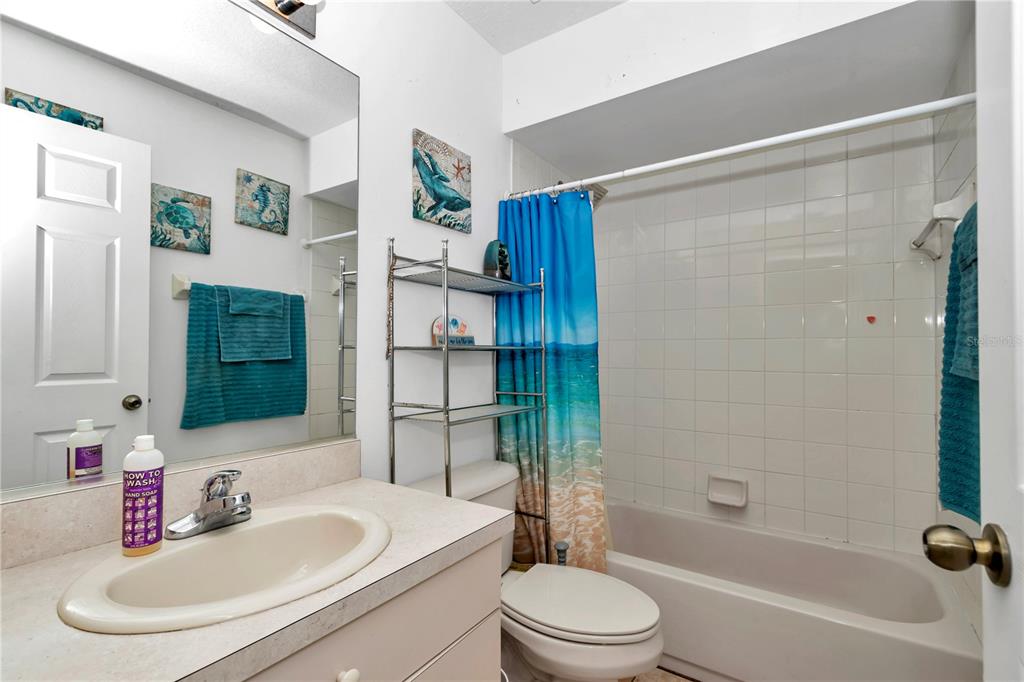 13800 Southwest 33rd Court Road Ocala, FL 34473 - Photo 32 of 42 a bathroom with a sink toilet and shower