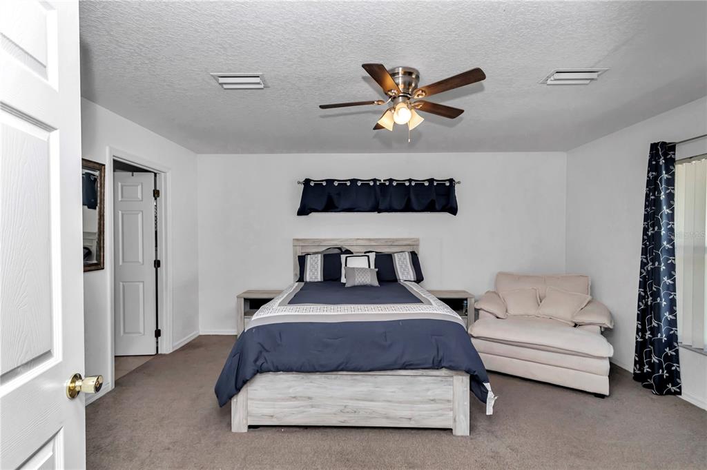 13800 Southwest 33rd Court Road Ocala, FL 34473 - Photo 34 of 42 a bedroom with a bed and window