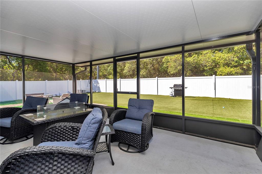 13800 Southwest 33rd Court Road Ocala, FL 34473 - Photo 39 of 42 a living room with furniture and a floor to ceiling window