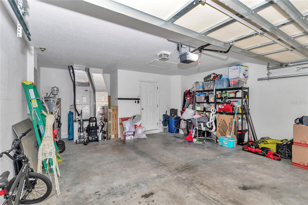 13800 Southwest 33rd Court Road Ocala, FL 34473 - Photo 42 of 42 a view of a garage with rack and bicycle